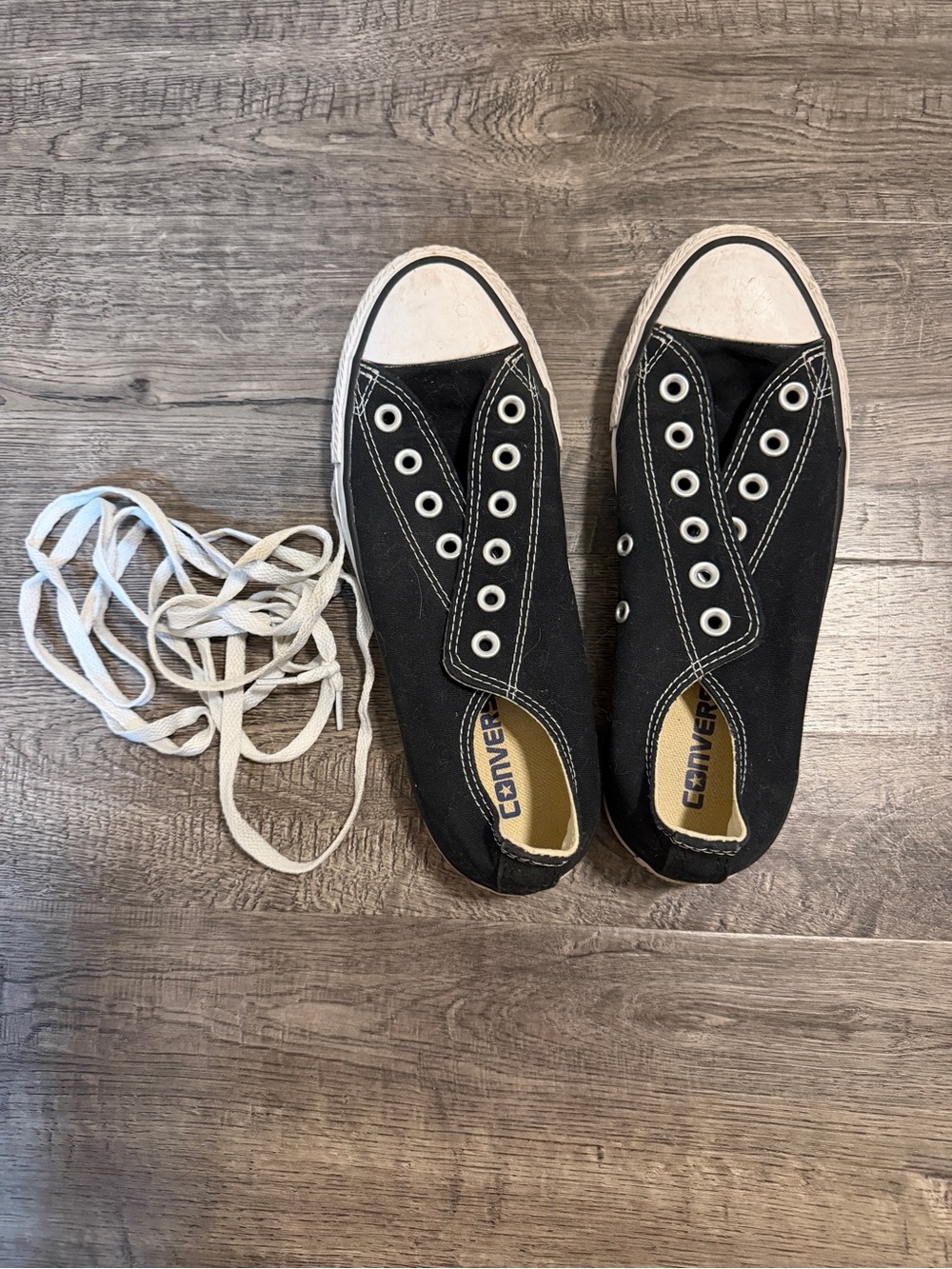 Converse Women’s Black Canvas Slip-On Sneakers with White Accents
